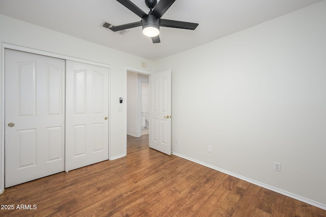 25825 N 65th Ave, Phoenix, AZ 85083 - unfurnished bedroom featuring baseboards, wood finished floors, visible vents, and a closet
