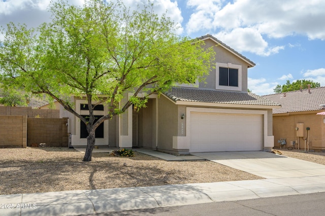 25825 N 65th Ave, Phoenix, AZ 85083 - view of front of house with a tile roof, driveway, fence, a garage, and stucco siding