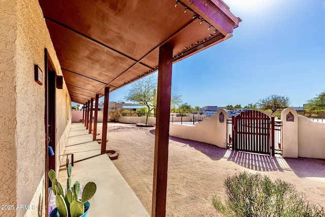 view of patio with a gate and fence private yard