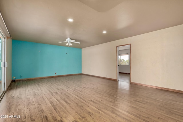 unfurnished room with recessed lighting, wood finished floors, baseboards, and ceiling fan