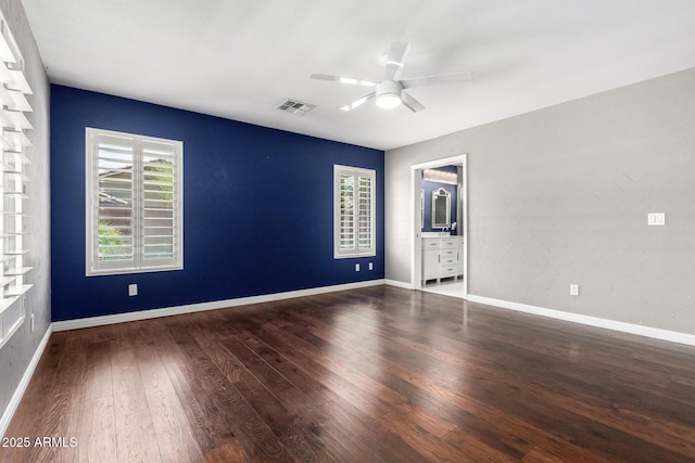 3913 E Derringer Way, Gilbert, AZ 85297 - spare room featuring wood-type flooring, a ceiling fan, and baseboards