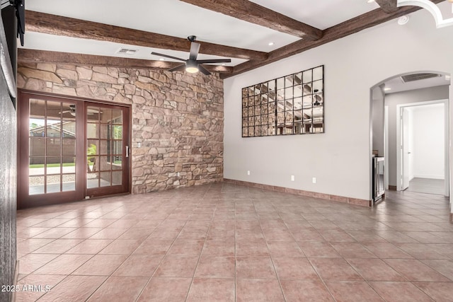 3913 E Derringer Way, Gilbert, AZ 85297 - empty room featuring arched walkways, a ceiling fan, beamed ceiling, tile patterned floors, and baseboards
