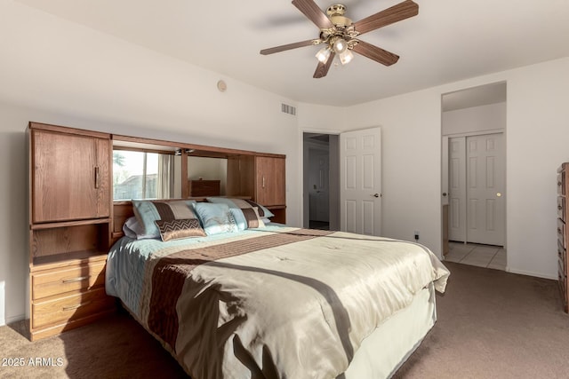 bedroom featuring ceiling fan and dark colored carpet