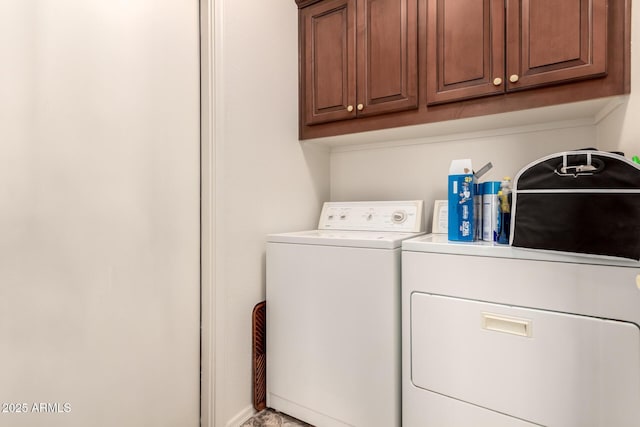 laundry area with cabinets and independent washer and dryer