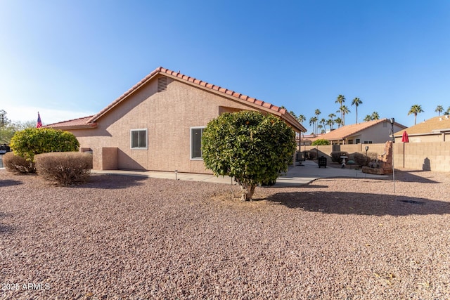 back of property featuring a patio