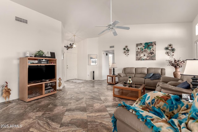 living room featuring ceiling fan and high vaulted ceiling