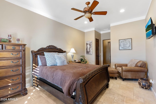 bedroom featuring ceiling fan, ornamental molding, and a closet