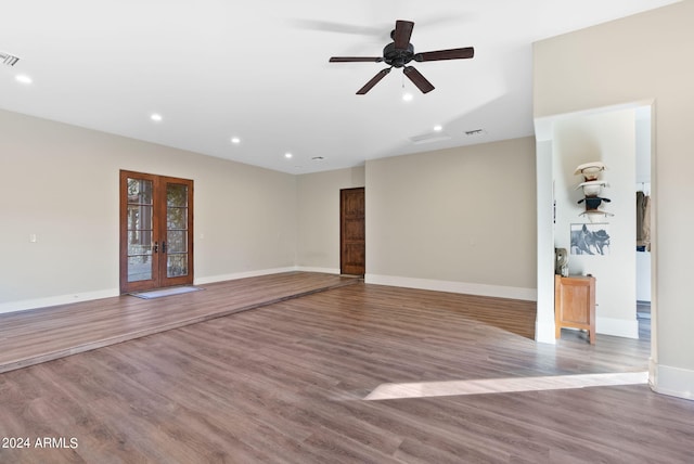 spare room with french doors, ceiling fan, and light hardwood / wood-style flooring