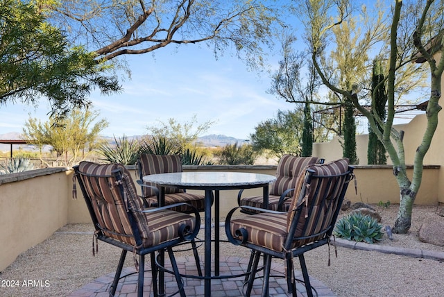 view of patio / terrace with a mountain view