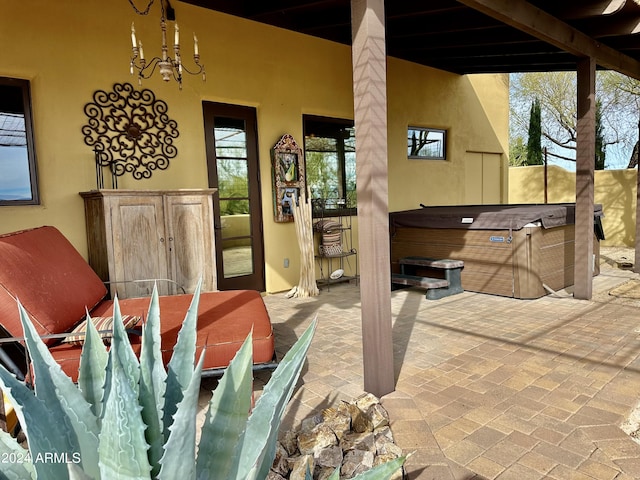 view of patio / terrace featuring a hot tub