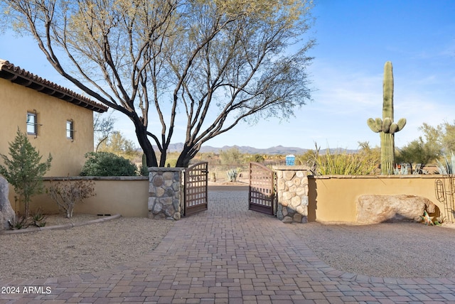 view of gate featuring a mountain view