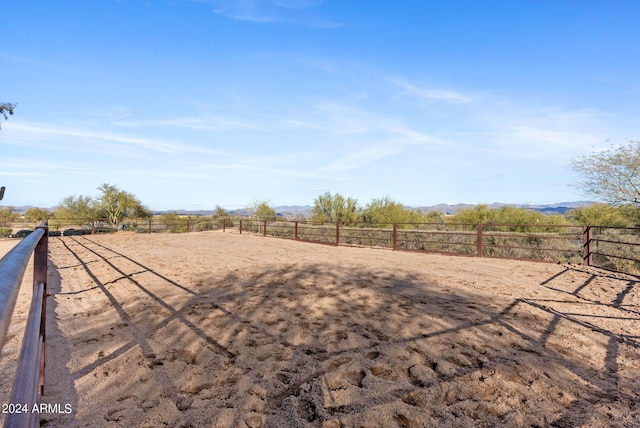 view of yard with a rural view