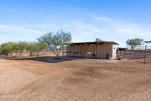 view of outdoor structure with a rural view