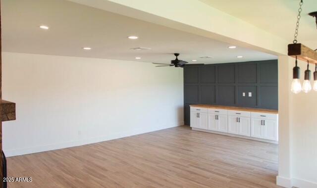 unfurnished living room with light wood-style flooring, recessed lighting, and ceiling fan