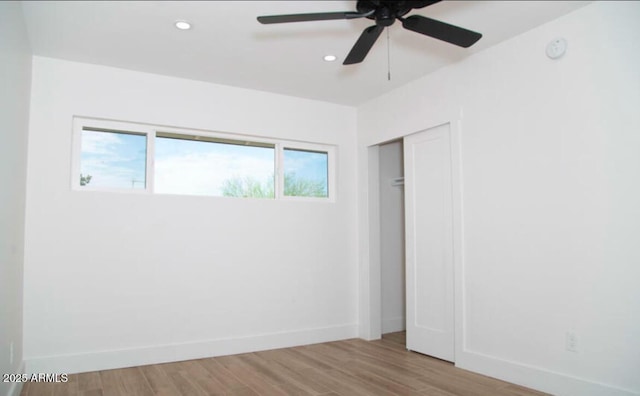 unfurnished room featuring a ceiling fan, recessed lighting, wood finished floors, and baseboards