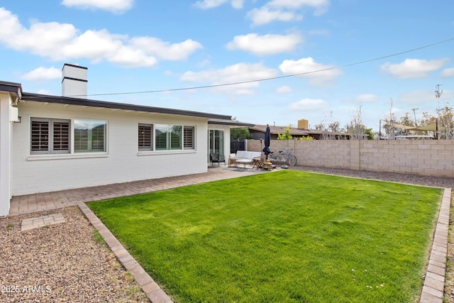 view of yard featuring a patio and a fenced backyard