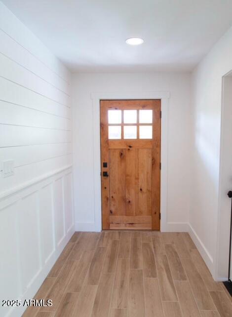 doorway to outside featuring light wood-type flooring