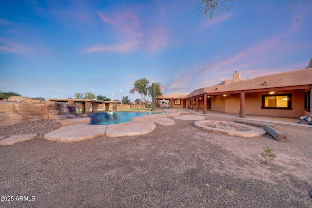 28758 N Ashbrook Ln, San Tan Valley, AZ 85144 - pool at dusk featuring a patio
