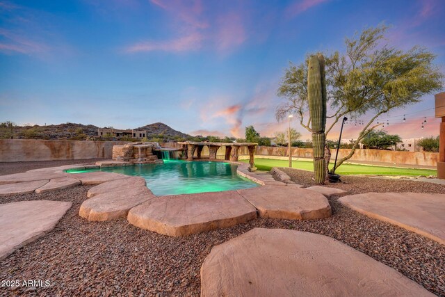 28758 N Ashbrook Ln, San Tan Valley, AZ 85144 - pool at dusk with a fenced backyard and a patio