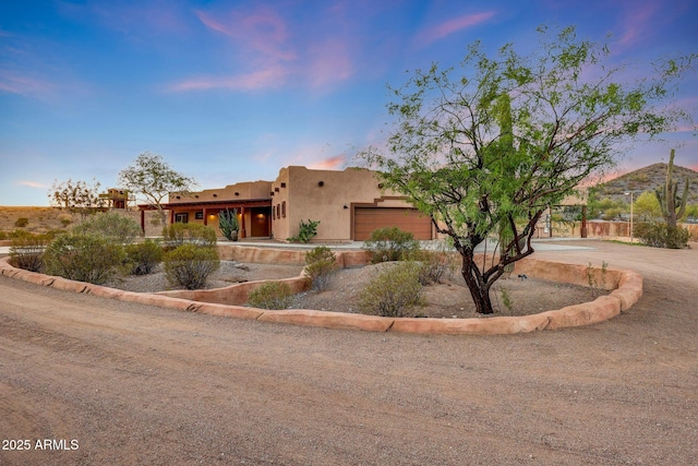 28758 N Ashbrook Ln, San Tan Valley, AZ 85144 - southwest-style home with a garage, stucco siding, and driveway