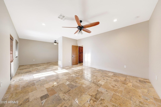 28758 N Ashbrook Ln, San Tan Valley, AZ 85144 - unfurnished room with stone tile floors, a ceiling fan, and recessed lighting