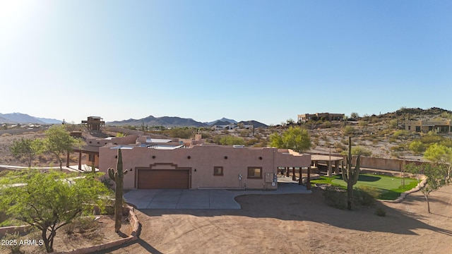 28758 N Ashbrook Ln, San Tan Valley, AZ 85144 - view of front of property with a mountain view, an attached garage, stucco siding, and concrete driveway