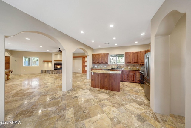28758 N Ashbrook Ln, San Tan Valley, AZ 85144 - kitchen with a sink, a center island, backsplash, open floor plan, and recessed lighting