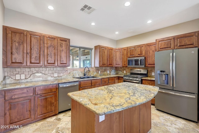 28758 N Ashbrook Ln, San Tan Valley, AZ 85144 - kitchen featuring stainless steel appliances, a sink, recessed lighting, light stone countertops, and backsplash