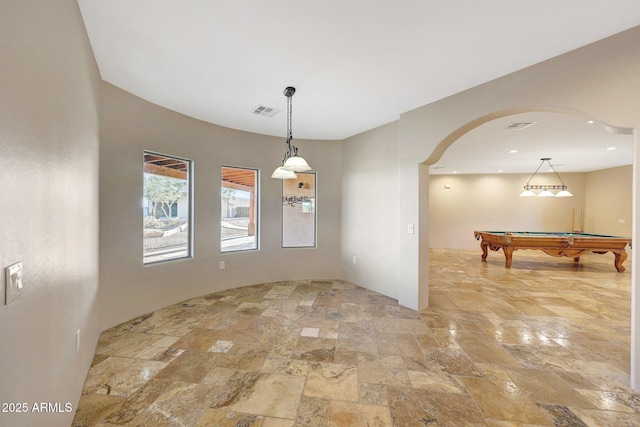 28758 N Ashbrook Ln, San Tan Valley, AZ 85144 - unfurnished room featuring stone tile floors, arched walkways, and pool table