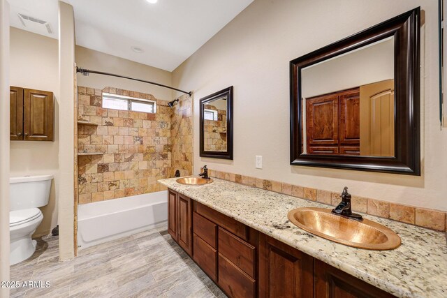 28758 N Ashbrook Ln, San Tan Valley, AZ 85144 - bathroom with toilet, shower / tub combination, double vanity, and wood finished floors