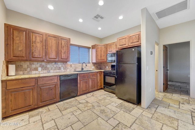 28758 N Ashbrook Ln, San Tan Valley, AZ 85144 - kitchen with black appliances, a sink, tasteful backsplash, brown cabinetry, and recessed lighting