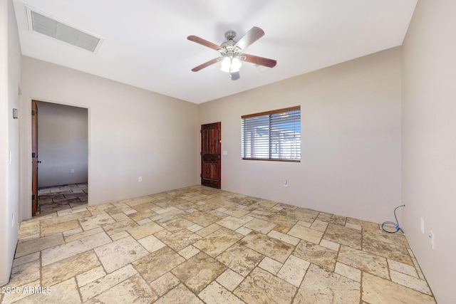 28758 N Ashbrook Ln, San Tan Valley, AZ 85144 - spare room featuring stone tile floors and ceiling fan