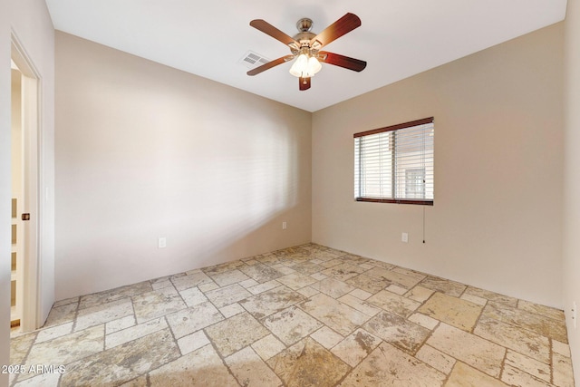 28758 N Ashbrook Ln, San Tan Valley, AZ 85144 - empty room with stone tile flooring and ceiling fan