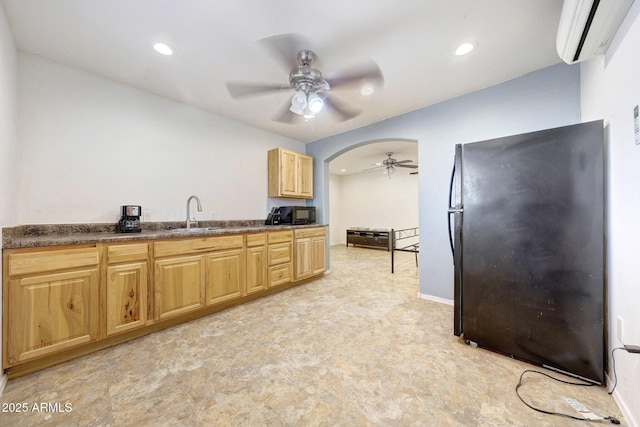 28758 N Ashbrook Ln, San Tan Valley, AZ 85144 - kitchen featuring black appliances, a wall mounted air conditioner, ceiling fan, a sink, and dark countertops