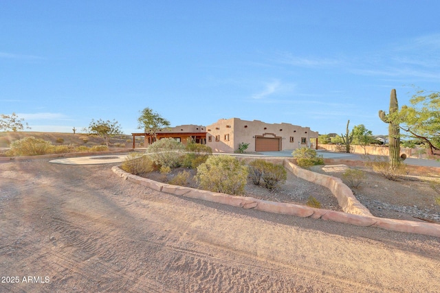 28758 N Ashbrook Ln, San Tan Valley, AZ 85144 - pueblo revival-style home with an attached garage, driveway, and stucco siding