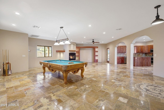 28758 N Ashbrook Ln, San Tan Valley, AZ 85144 - playroom with recessed lighting, stone tile floors, billiards table, a ceiling fan, and arched walkways