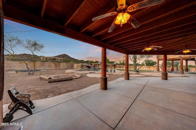 28758 N Ashbrook Ln, San Tan Valley, AZ 85144 - patio terrace at dusk featuring ceiling fan and a patio