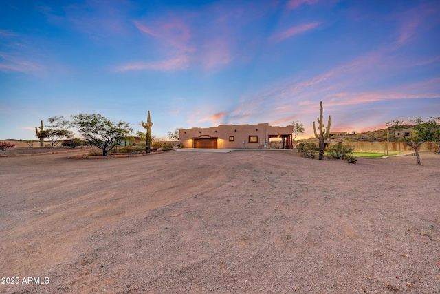 28758 N Ashbrook Ln, San Tan Valley, AZ 85144 - pueblo revival-style home with an attached garage, driveway, and stucco siding