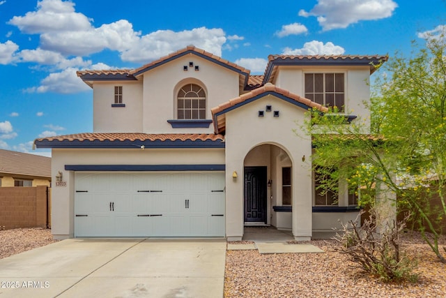12023 W Duane Ln, Peoria, AZ 85383 - mediterranean / spanish-style home featuring a tiled roof, stucco siding, a garage, and concrete driveway