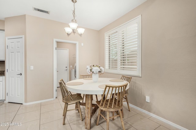 12023 W Duane Ln, Peoria, AZ 85383 - dining room with a chandelier, baseboards, and light tile patterned flooring