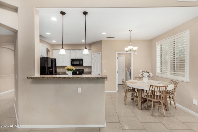 12023 W Duane Ln, Peoria, AZ 85383 - kitchen featuring black appliances, baseboards, white cabinetry, a chandelier, and a peninsula