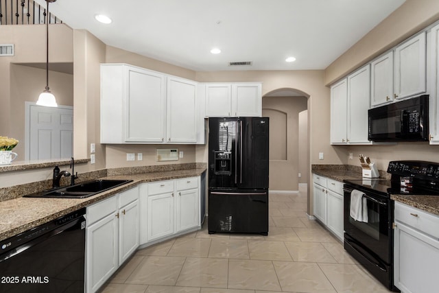 12023 W Duane Ln, Peoria, AZ 85383 - kitchen with black appliances, a sink, arched walkways, recessed lighting, and white cabinets