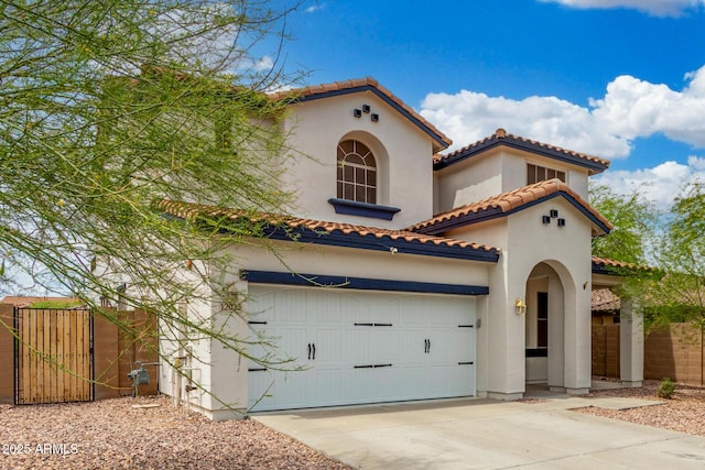12023 W Duane Ln, Peoria, AZ 85383 - mediterranean / spanish-style house with a tile roof, fence, stucco siding, and driveway