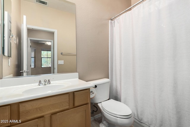 12023 W Duane Ln, Peoria, AZ 85383 - bathroom featuring toilet, vanity, and a shower with shower curtain