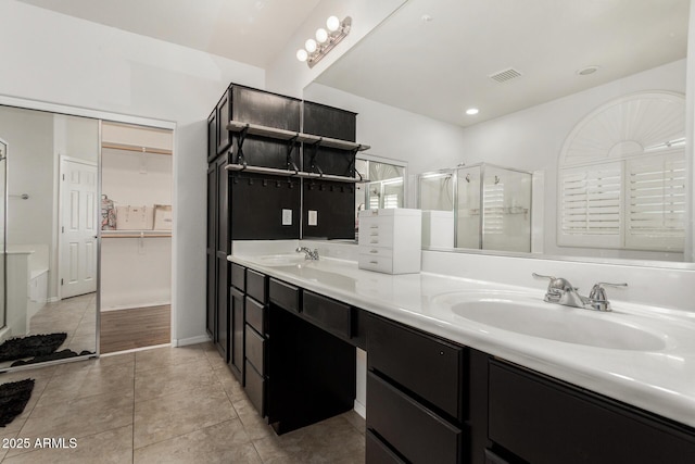 12023 W Duane Ln, Peoria, AZ 85383 - bathroom with a shower stall, double vanity, a spacious closet, tile patterned floors, and recessed lighting
