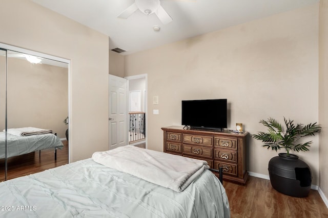 12023 W Duane Ln, Peoria, AZ 85383 - bedroom featuring wood finished floors, a closet, ceiling fan, and baseboards