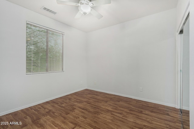 12023 W Duane Ln, Peoria, AZ 85383 - unfurnished room featuring dark wood-style floors, ceiling fan, and baseboards