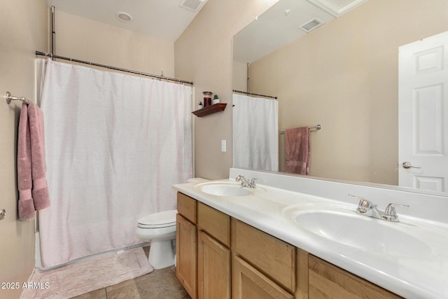 12023 W Duane Ln, Peoria, AZ 85383 - bathroom featuring toilet, double vanity, curtained shower, and tile patterned flooring