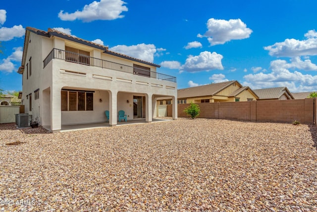 12023 W Duane Ln, Peoria, AZ 85383 - rear view of house featuring a balcony, central AC unit, a patio, and stucco siding