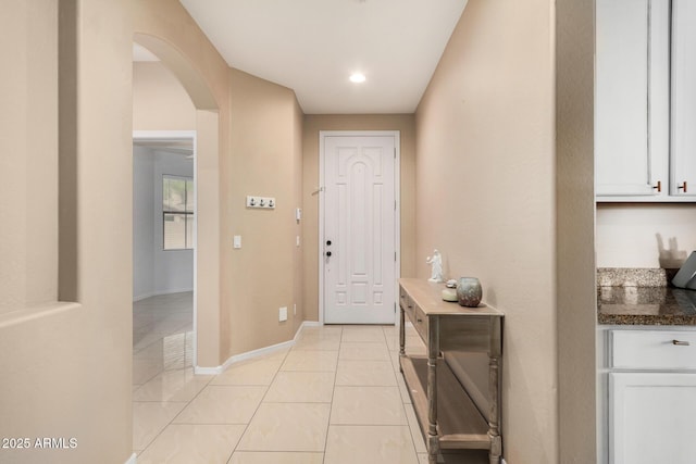 12023 W Duane Ln, Peoria, AZ 85383 - entrance foyer featuring arched walkways, baseboards, and light tile patterned floors